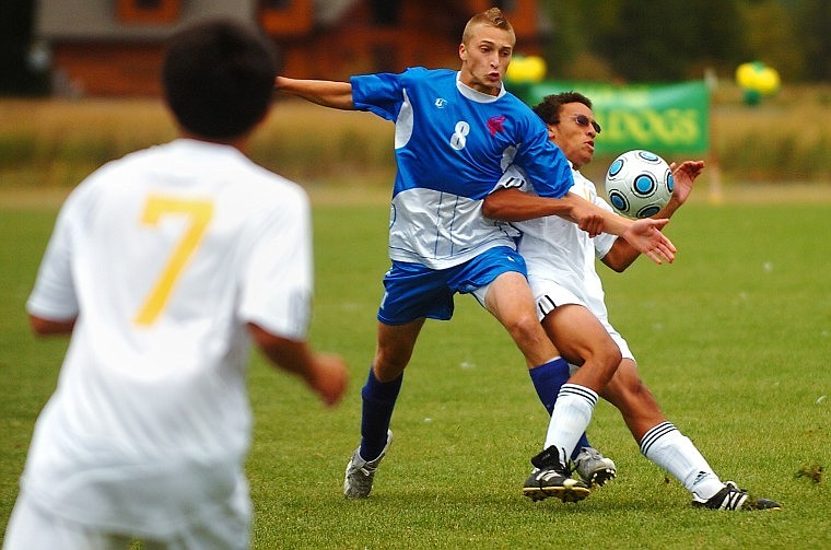 Bigfork's Skyler Doak (8) and Whitefish's Anto Daoud battle for position and the ball while Whitefish's Devon Sellwood looks on during Tuesday's Northern A soccer match in Whitefish.