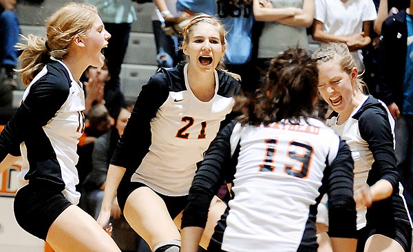 &lt;p&gt;Flathead's Emma Andrews (left), Kwyn Johnson (21), Emily Russell
(right), and Cassie Krueger (19), celebrate during game two of
their crosstown volleyball matchup with Glacier on Thursday at
Flathead High School.&lt;/p&gt;