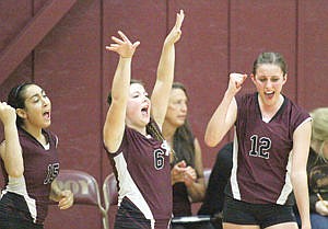 <p>Bench explodes on a fifth set ace with Rebecca Rotolo, left, Tana Thill and Sami Rohrich vs. Noxon Oct. 2.</p>