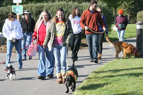 &lt;p&gt;Mary Powell of Rathdrum and her black lab-dachshund mix Willie walk the circuit of the 2013 Drool Stampede in Riverstone Park.&lt;/p&gt;