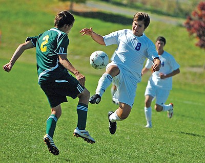 Junior Giorgio Traini handles the ball for Polson during their game against Whitefish on Friday. The Pirates defeated the Bulldogs 2-1 to clinch at least the second seed in the playoffs.