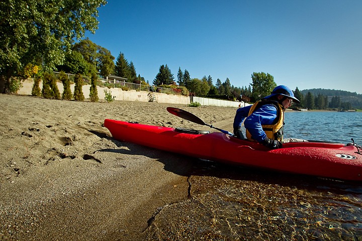 &lt;p&gt;John Mathys launches a kayak Wednesday from the public section of Sanders Beach.&lt;/p&gt;