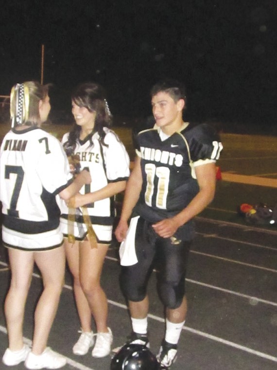 Junior Princess Makynlee Miller, accompanied by Prince Alex
Myrick, is all smiles as her name is announced.