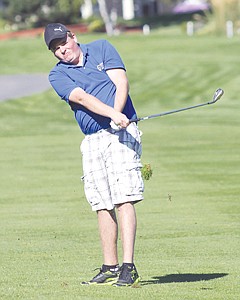 &lt;p&gt;Libby's Morgan Wilkins hits his second shot on No. 10 at Polson Bay Golf Course in Day 1 action at the Class A state tournament.&lt;/p&gt;