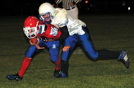 Nick Ianniello/Mineral Independent Superior Bobcat Travis Stroot pushes through the Pirates defense during the third quarter of their game Friday night.