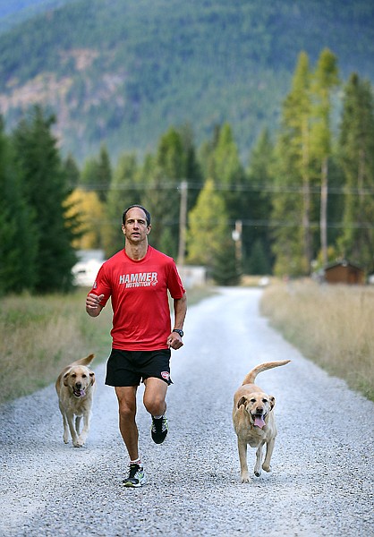 <p>Scott Gaiser out with his dogs on Monday, October 1, near his home in Creston.</p>