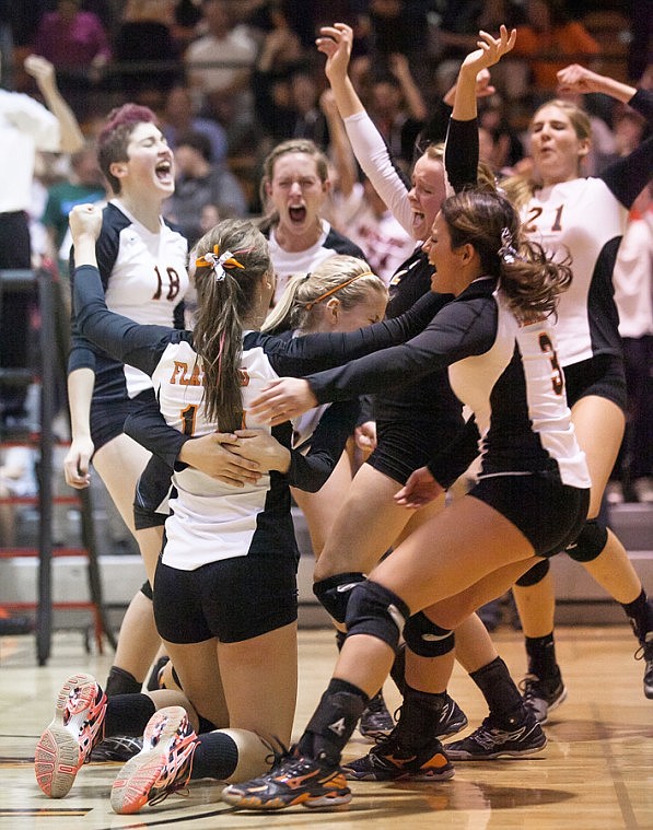 &lt;p&gt;Flathead girls celebrate Cassie Krueger's (center) match-winning point over Glacier Thursday night during a crosstown volleyball matchup at Flathead High School.&lt;/p&gt;