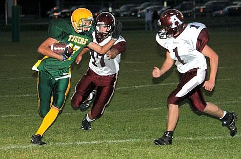 Nick Ianniello/Mineral Independent St. Regis sophomore Thomas Spencer dodges Alberton Panthers at the Tigers&#146; homecoming game Wednesday night. The Panthers came out on top 54 to 26.