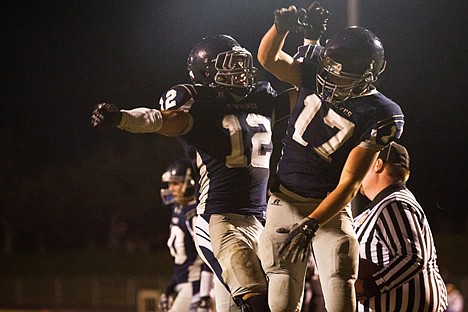 &lt;p&gt;Lake City's Colton Houlihan (17) and Danny Brum (12) celebrate after Houlihan scored a touchdown in the third quarter Friday in Coeur d'Alene.&lt;/p&gt;