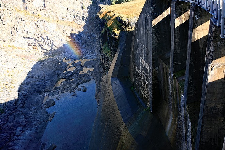 Light refracts through the mists creating a rainbow at Kerr Dam.