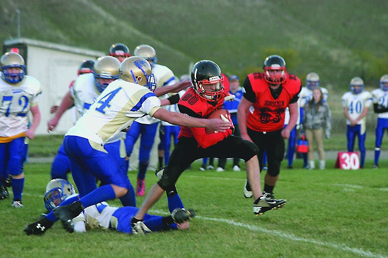 &lt;p&gt;Horseman Trent Brouillette works his way further from the Bluehawks' defense during the Homecoming game.&lt;/p&gt;