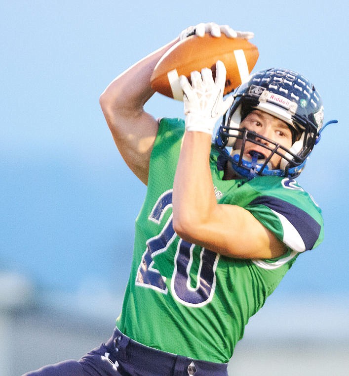 <p>Glacier senior Evan Epperly hauls in a pass Friday night during the Wolfpack's victory over Missoula Big Sky at Legends Stadium. </p>