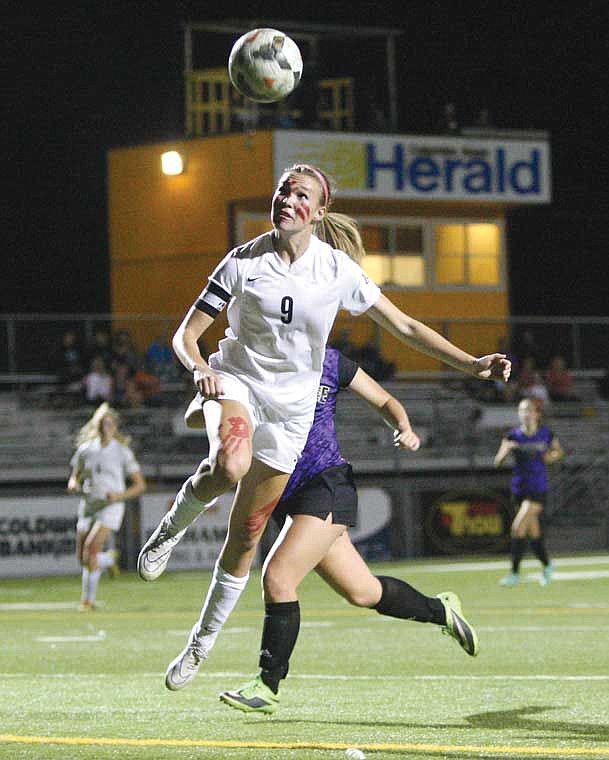 Moses Lake forward Alysha Overland attempts a header against Wenatchee Tuesday, Oct. 7, at Lions Field.