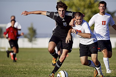 &lt;p&gt;Coeur d'Alene High's Dillon Dunteman battles Brady Ulen from Post Falls as they race to the ball Monday in the 5A Region 1 championship game at Post Falls High.&lt;/p&gt;