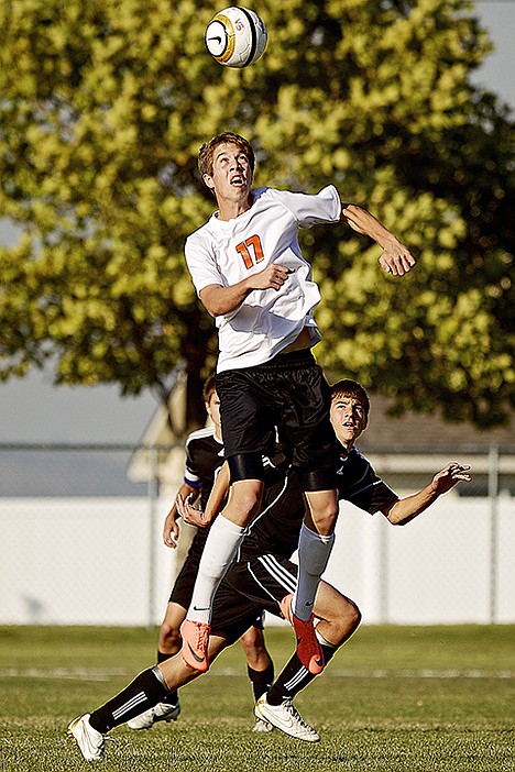 &lt;p&gt;Post Falls High's Kobi Nuss leap in front of Braden Ridgewell from Coeur d'Alene High during the first half.&lt;/p&gt;