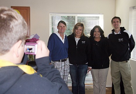 &lt;p&gt;Seth Mayer snaps a picture of, from left, Kathy French, Sarena Mayer, Marlys Milligan and Cory Johnson after a tour of the new home.&lt;/p&gt;