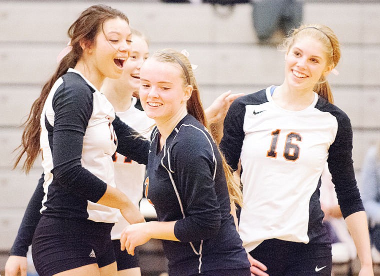 &lt;p&gt;(Right to left) Emma Andrews, Iris Matulevich, Ashli Petek, and Lizzie Sherwood celebrate a point Tuesday night during Flathead's win over Missoula Sentinel at Flathead High School. Oct. 8, 2013 in Kalispell, Montana. (Patrick Cote/Daily Inter Lake)&lt;/p&gt;