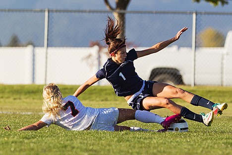 &lt;p&gt;Lake City's Sydney Quimby (1) falls to the ground after Post Falls' Hayley Eklund (7) slides while trying to steel the ball.&lt;/p&gt;