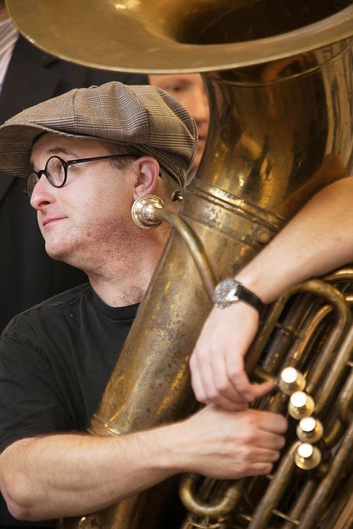 <p>Clint Baker of the Yerba Buena Stompers takes a break from playing the tuba during the opening ceremony of the Glacier Jazz Stampede at the Kalispell Center Mall on Friday afternoon.</p>