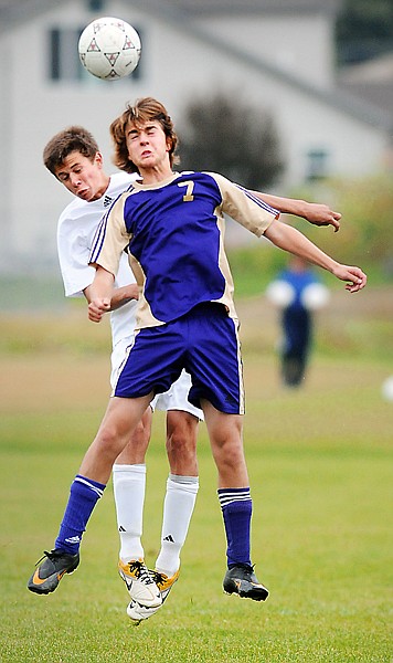 <p>Polson freshman Sam Heutmaker, 7, and Stillwater junior Zachary
Waldher, 5, compete for the ball during their game on Tuesday in
Kalispell.</p>