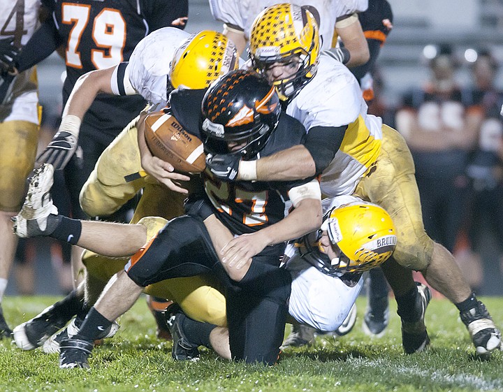 &lt;p&gt;Flathead&#160; senior&#160; running back Juston Windom (27) is stopped in
his tracks by three Bruins defenders during Flathead&#146;s loss to
Helena Capital at Legends Stadium on Friday night.&lt;/p&gt;