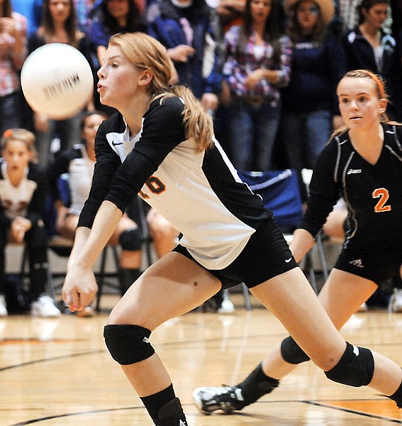 <p>Flathead sophomore Emma Andrews (16) hits the ball during the
crosstown volleyball matchup against Glacier on Thursday night. In
the background is sophomore Iris Matulevich (2).</p>