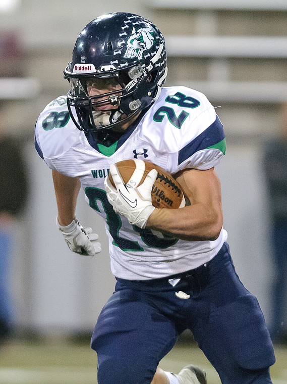 <p>Logan Jones runs the ball Friday night during Glacier's 59-41 victory over Missoula Sentinel at Washington-Grizzly Stadium in Missoula. Oct. 11, 2013 in Missoula, Montana. (Patrick Cote/Daily Inter Lake)</p>
