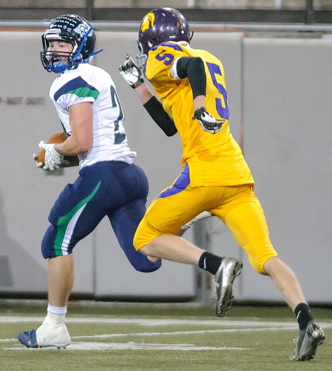 &lt;p&gt;Evan Epperly (20) looks back on his way to a touchdown Friday night during Glacier's 59-41 victory over Missoula Sentinel at Washington-Grizzly Stadium in Missoula. Oct. 11, 2013 in Missoula, Montana. (Patrick Cote/Daily Inter Lake)&lt;/p&gt;