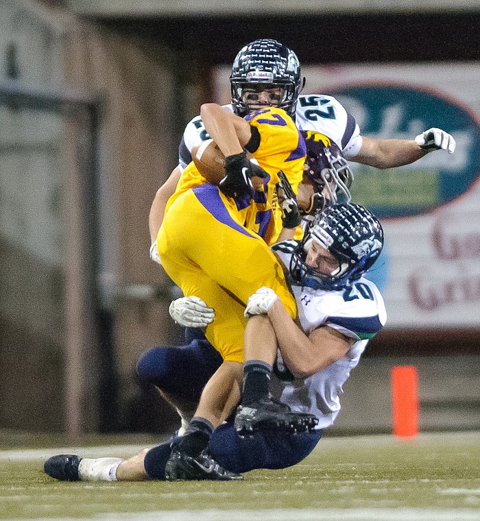 &lt;p&gt;Evan Epperly (20) and Dalton Meredith (25) make a tackle Friday night during Glacier's 59-41 victory over Missoula Sentinel at Washington-Grizzly Stadium in Missoula. Oct. 11, 2013 in Missoula, Montana. (Patrick Cote/Daily Inter Lake)&lt;/p&gt;