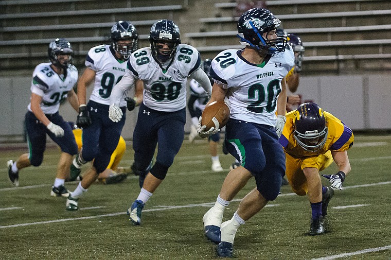 &lt;p&gt;Evan Epperly (20) runs the ball Friday night during Glacier's 59-41 victory over Missoula Sentinel at Washington-Grizzly Stadium in Missoula. Oct. 11, 2013 in Missoula, Montana. (Patrick Cote/Daily Inter Lake)&lt;/p&gt;