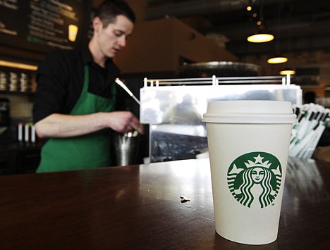 &lt;p&gt;In this Friday, April 27, 2012, photo, a Starbucks drink waits for a customer to pick it up as barista Josh Barrow prepares another, in Seattle.&lt;/p&gt;