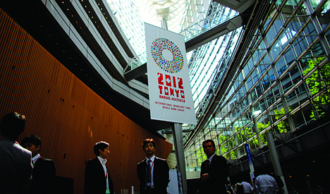 &lt;p&gt;FILE - In this Monday, Oct. 8, 2012, file photo, people hang out at the venue of the IMF meeting in Tokyo. When global finance ministers meet this week in Tokyo, they'll confront a triple challenge: Economic troubles in three major regions are threatening the world's economy. (AP Photo/Junji Kurokawa)&lt;/p&gt;