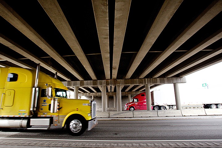 &lt;p&gt;JEROME A. POLLOS/Press File Photo Two semi-trucks pass under the U.S. 95 overpass Friday, April 1, 2011 while traveling on Interstate-90 in Coeur d'Alene.&lt;/p&gt;