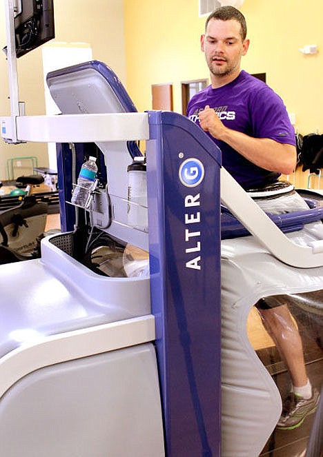 <p>Jeff Hobbs, who was born with the spastic type of cerebral palsy, trains for the Chicago Marathon on an anti-gravity treadmill at Genesis Physical Therapy and Sports Medicine in Davenport.</p>