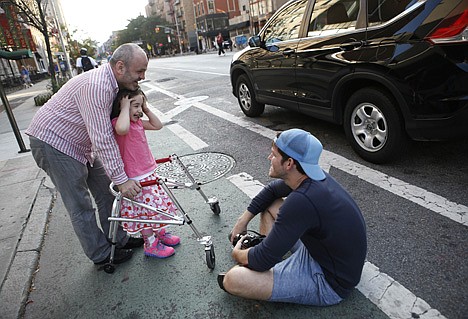 &lt;p&gt;Photographer Brandon Stanton, creator of the Humans of New York blog, right, after snapping a portrait of Mecit Kabatas and his five year-old daughter Bayza in New York.&lt;/p&gt;