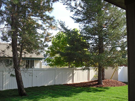 &lt;p&gt;Front and rear yards are landscaped with sprinkler systems, and tucked in the mature trees.&lt;/p&gt;