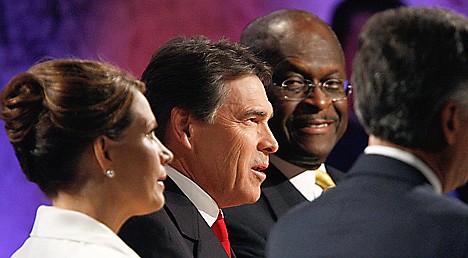 &lt;p&gt;Republican presidential candidates Rep. Michele Bachmann, R-Minn., Texas Gov. Rick Perry and businessman Herman Cain participate in a Republican presidential debate at Dartmouth College in Hanover, N.H., Tuesday, Oct. 11, 2011. (AP PhotoScott Eells, Pool)&lt;/p&gt;