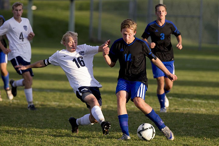 &lt;p&gt;The Coeur d'Alene Vikings and Lake City Timberwolves duked it out in boys soccer as they battled for the 5A Region 1 championship title on Wednesday, Oct. 12, 2016 at Lake City High School. After going into double overtime, Coeur d'Alene's Austin Garitone sneaked one past Lake City's goalkeeper, clinching the Viking's state playoff spot with a 3-2 victory. To purchase photo, please visit cdapress.com/photo&lt;/p&gt;