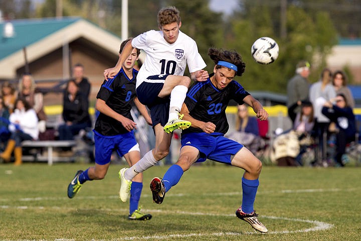 &lt;p&gt;Lake City sophomore Greyden Lee (10) smashes into Jason Lukes of Coeur d'Alene at the 5A Region 1 championship on Wednesday at Lake City High School. Coeur d'Alene defeated Lake City 3-2 in double overtime.&lt;/p&gt;