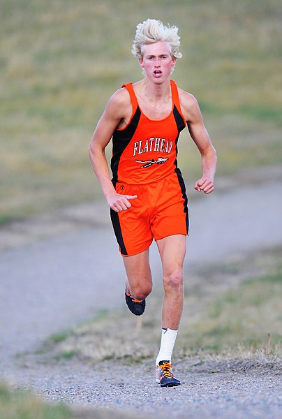 <p>Flatheads Zach Perrin pulls ahead of the pack early in a cross
country meet on Thursday afternoon at Kidsports Complex.</p>