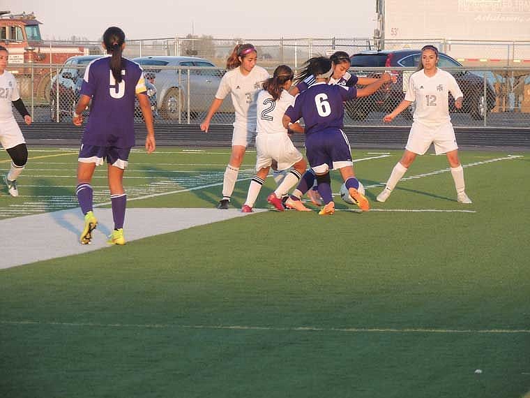Royal's Flor Araujo (3), Elsie Delgado (2) and Diana Medina (12) compete for control of the ball with two Connell girls.