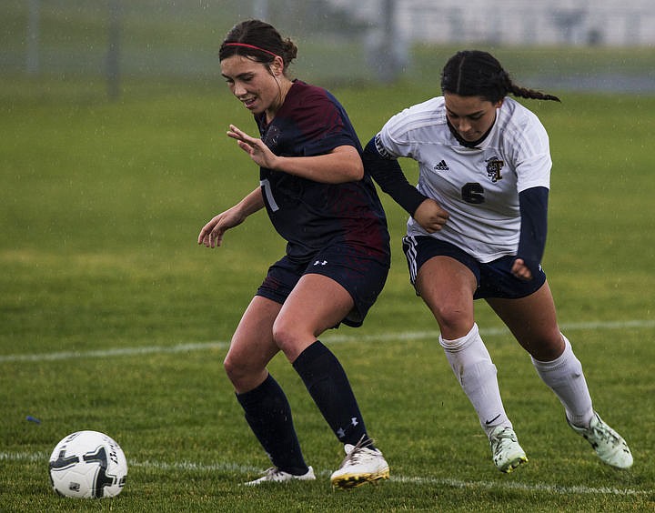 &lt;p&gt;Coeur d'Alene Charter and Timberlake High School girls soccer squads duke it out in the rain for the 3A Championship 1-2 title, Thursday, Oct. 13, 2016 at Lake City High School. Cd&#146;A Charter went up 3-1 in the 52nd minute when McAfee took a feed from Cunningham. Coeur d&#146;Alene Charter (13-3-1) will open state tourney play vs. Filer (8-4-1) next Thursday at 1 p.m. PDT at the Sunway Soccer Complex in Twin Falls.&lt;/p&gt;