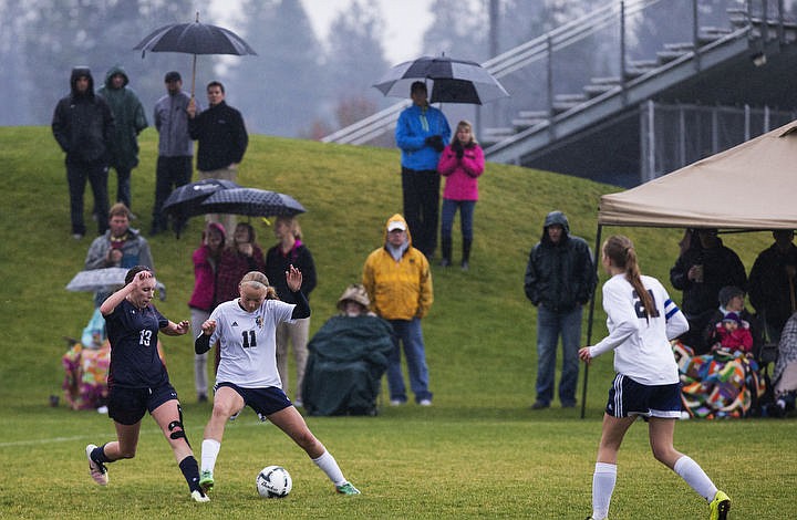 &lt;p&gt;Coeur d'Alene Charter and Timberlake High School girls soccer squads duke it out in the rain for the 3A Championship 1-2 title, Thursday, Oct. 13, 2016 at Lake City High School. Cd&#146;A Charter went up 3-1 in the 52nd minute when McAfee took a feed from Cunningham. Coeur d&#146;Alene Charter (13-3-1) will open state tourney play vs. Filer (8-4-1) next Thursday at 1 p.m. PDT at the Sunway Soccer Complex in Twin Falls.&lt;/p&gt;