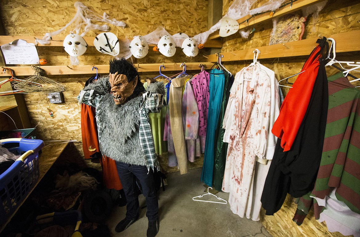 &lt;p&gt;Werewolf actor Chance Johnson tries on a costume top prior to opening night of the Post Falls Haunted House last Friday.&lt;/p&gt;