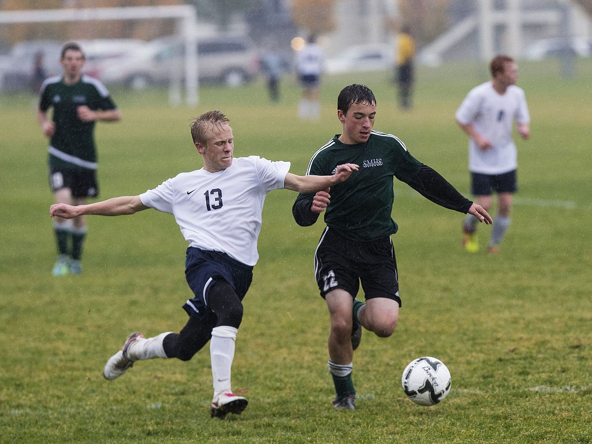 &lt;p&gt;LOREN BENOIT/Press St Maries' Kolby Moore (22) and Bonners Ferry's Tyler Blazer (13) run stride for stride as they battle for the ball during the 3A District 1-2 championship game on Thursday at Lake City High School. Banners Ferry won 2-1 in overtime.&lt;/p&gt;