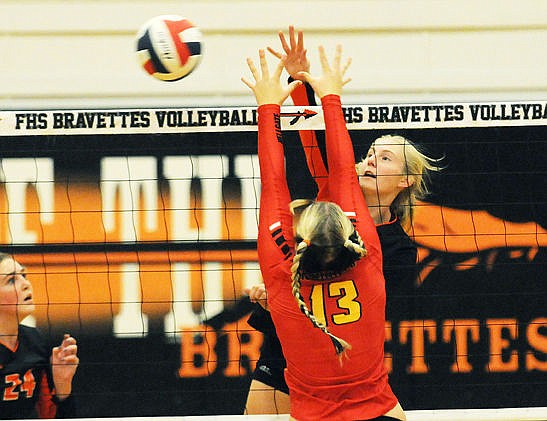 &lt;p&gt;Flathead's Tiana Johnson knocks a kill past Missoula Hellgate's Erin Szalda-Petree during the second game of a Western AA match at Flathead on Tuesday, Oct. 13 in this file photo. (Aaric Bryan/Daily Inter Lake)&lt;/p&gt;