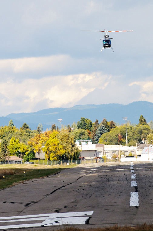 <p>A helicopter takes off Friday afternoon from Kalispell City Airport.</p>
