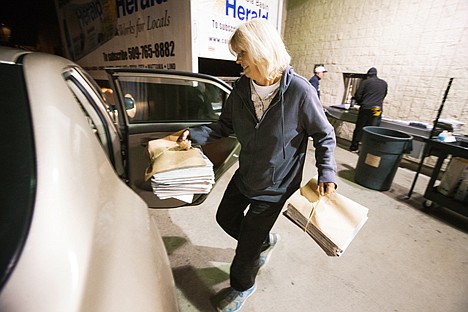 &lt;p&gt;Gwen McDonald, a carrier for the Press, loads her car with bundles of newspapers Friday before beginning her route. McDonald had the idea for the Press food drive where carriers pick up non-perishable food items from subscribers during paper delivery.&lt;/p&gt;