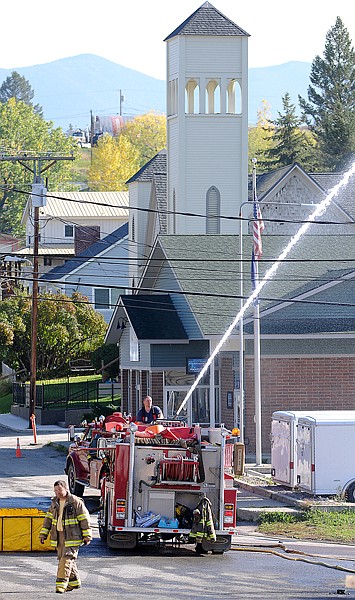 The Eureka Volunteer Fire Department works to put out the last fire at Glacier Bank at 222 Dewey Avenue on Thursday afternoon in Eureka.
