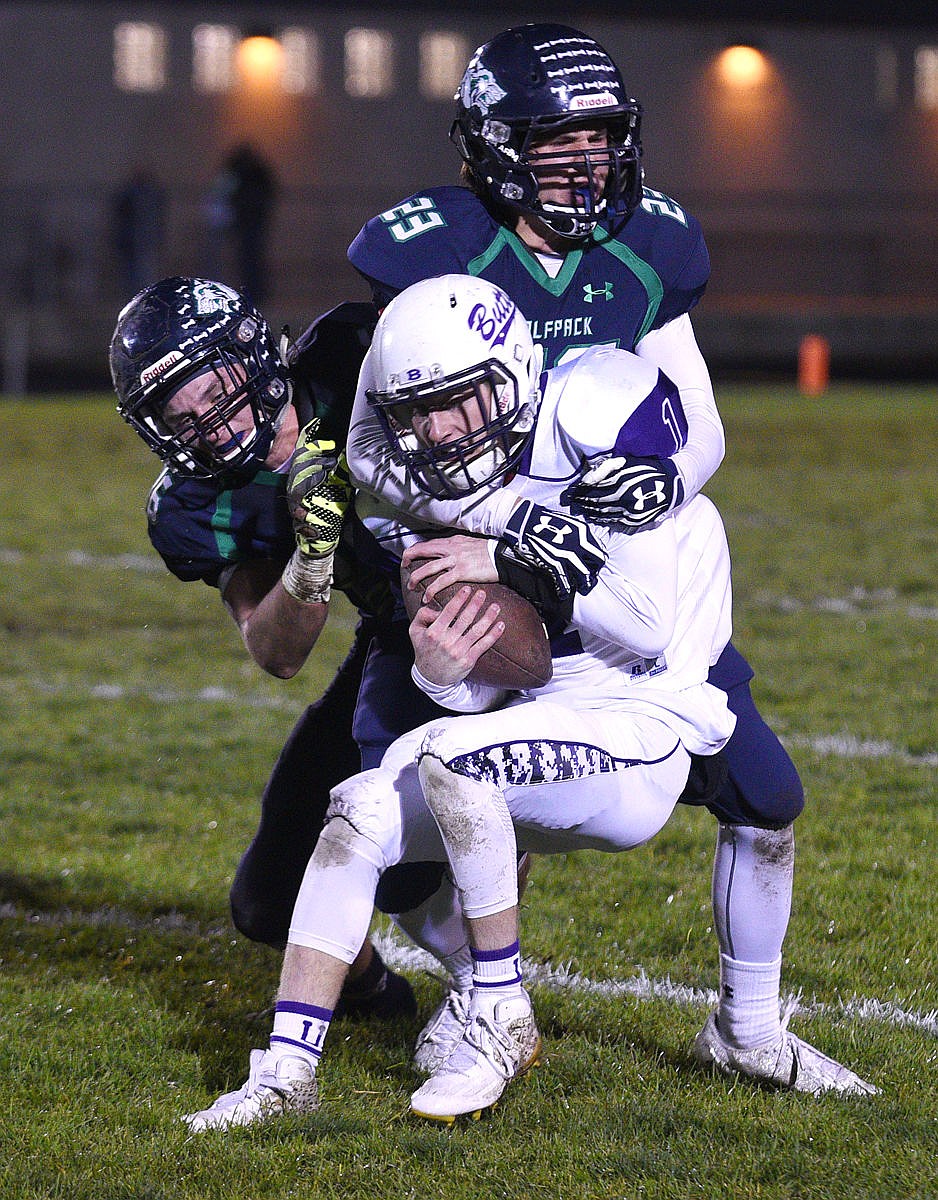 &lt;p&gt;Wolfpack defensive backs Lance Dannic (23) and Patrick O'Connell (16) stop Butte receiver Kiley Caprara short of a first down on a third down in the second quarter. (Aaric Bryan/Daily Inter Lake)&lt;/p&gt;